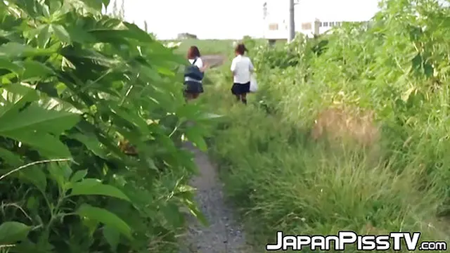 Japanese schoolgirls urinate during a nature trail adventure