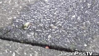 Sexy Japanese girl urinating near a bike rider