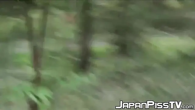 Hot Japanese girl pees behind bench in park &mdash;  skirt down