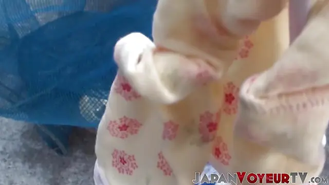 Japanese girl secretly caught urinating in public