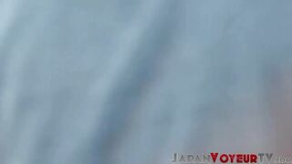 Teen Japanese legs tempt voyeur in open space