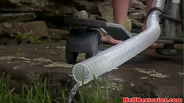 Ginger sub succumbs to enema and tight restraints