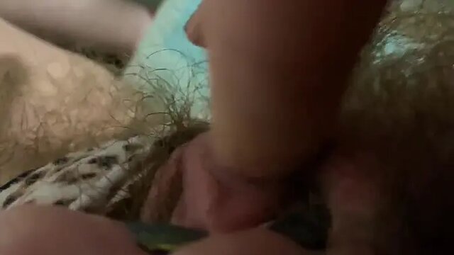 Amateur girl rubs her big hairy clit for a real orgasm