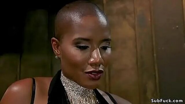 Ebony Dominatrix whips and bounces on submissive man in latex and straitjacket